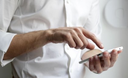 Man's hand on smart phone